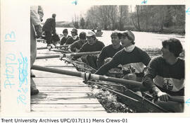 Photograph of a Trent men's rowing team docked